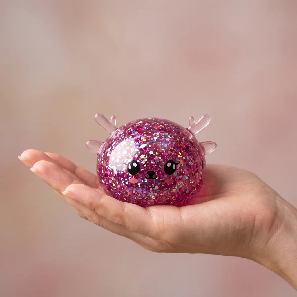 Twinkling Mystery Reindeer Dumpling Squishy resting on an open palm to show its real size