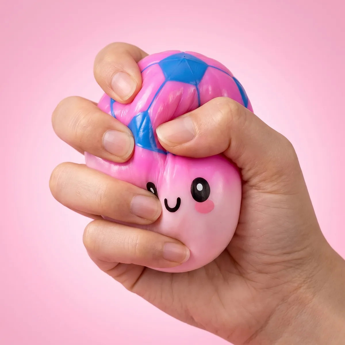 Mystery soccer dumpling squishy being squeezed showing slow rising foam