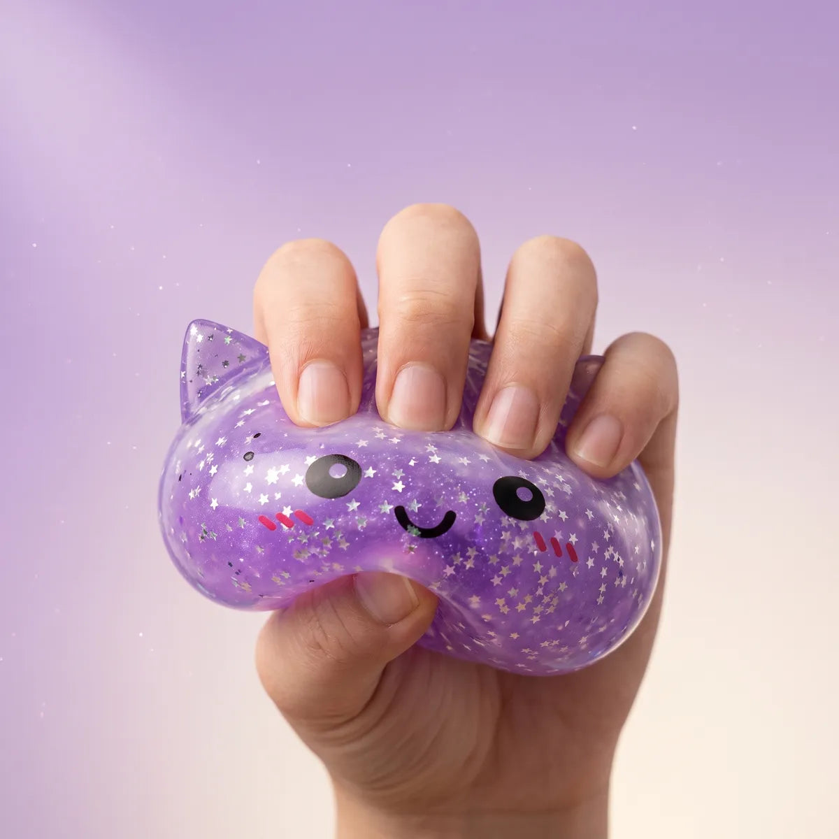 Sparkle unicorn dumpling squishy squeezed flat to show its slow rising rebound