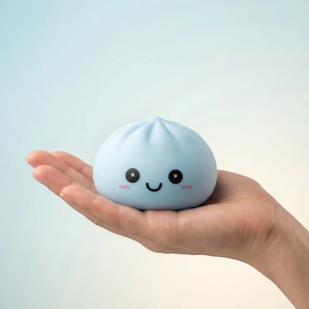 Mystery squishy dumpling night light held in hand lifestyle shot