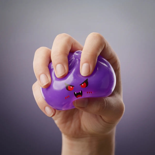 Hand squeezing a mystery vampire dumpling squishy to show its slow rise