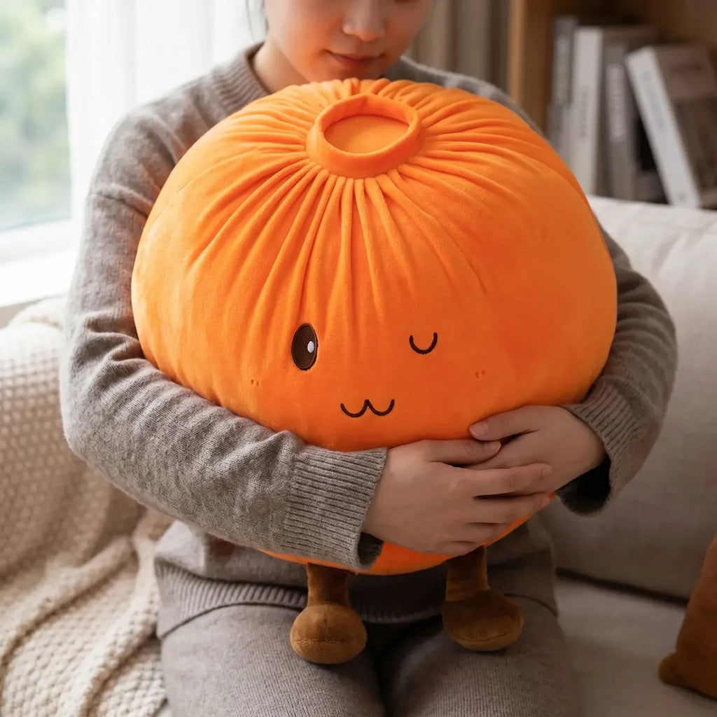 Person hugging the orange large dumpling squishy plush pillow