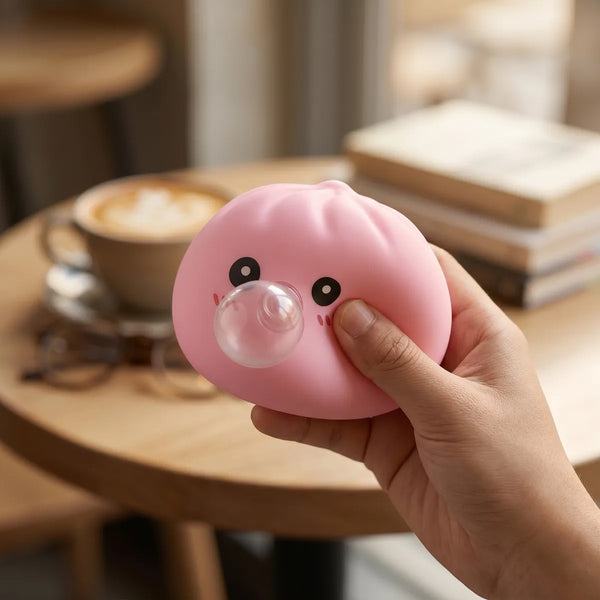 Pink blow dumpling squishy styled as cute desk decor