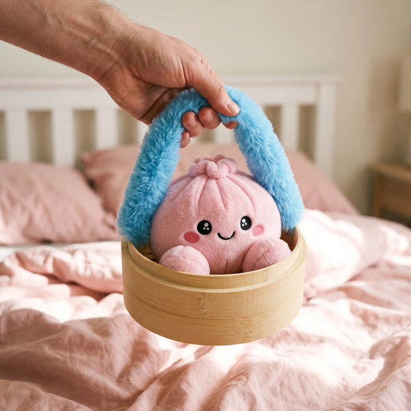 Hand carrying the Peony Pink Dumpling Squishy Plush in its steamer case by the fluffy handle