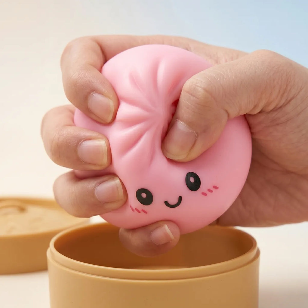 Pink dumplings squishy being squeezed showing slow rising foam
