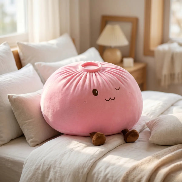Pink large dumpling squishy plush pillow in a cozy bedroom