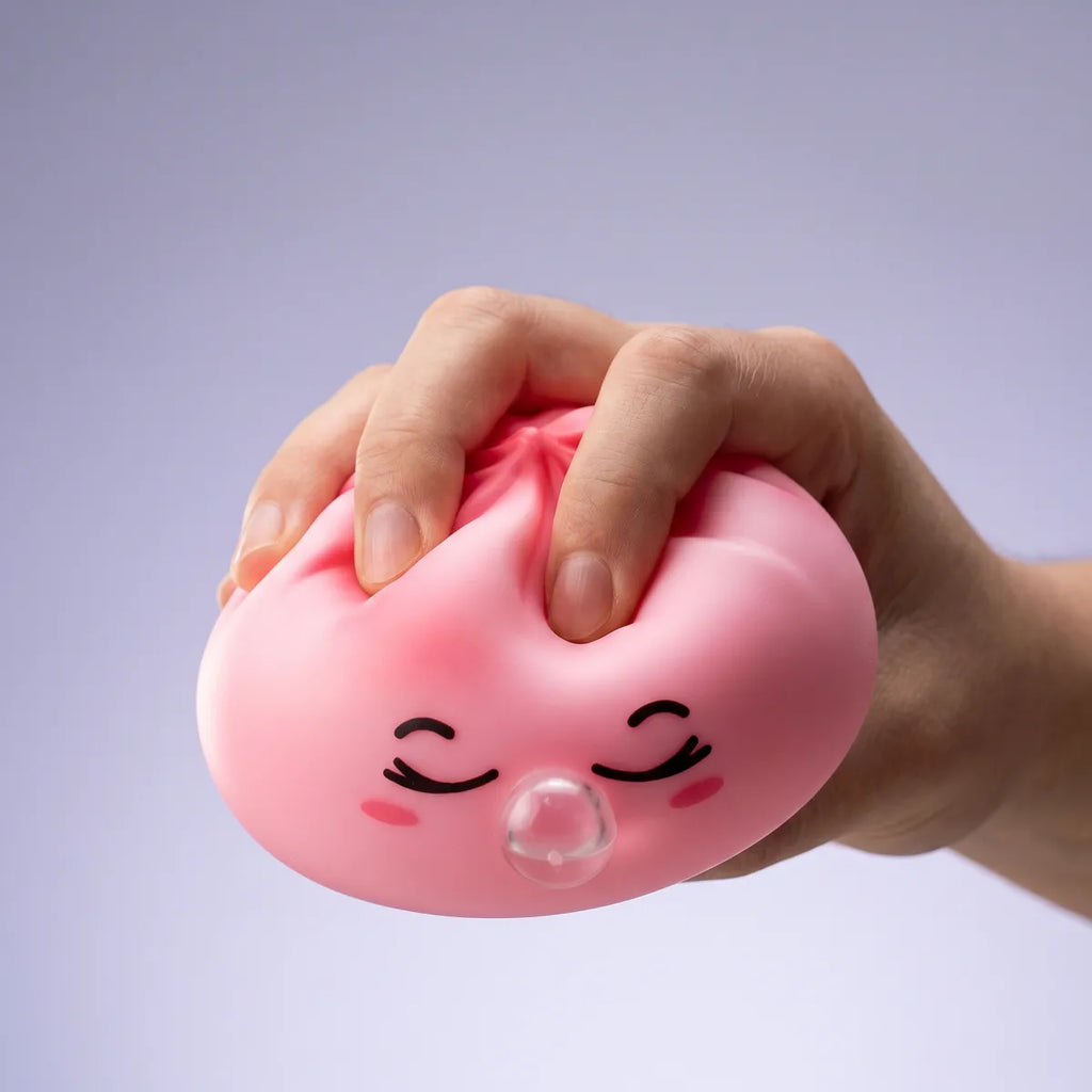 Pink rare blow dumpling squishy slowly rising back to shape