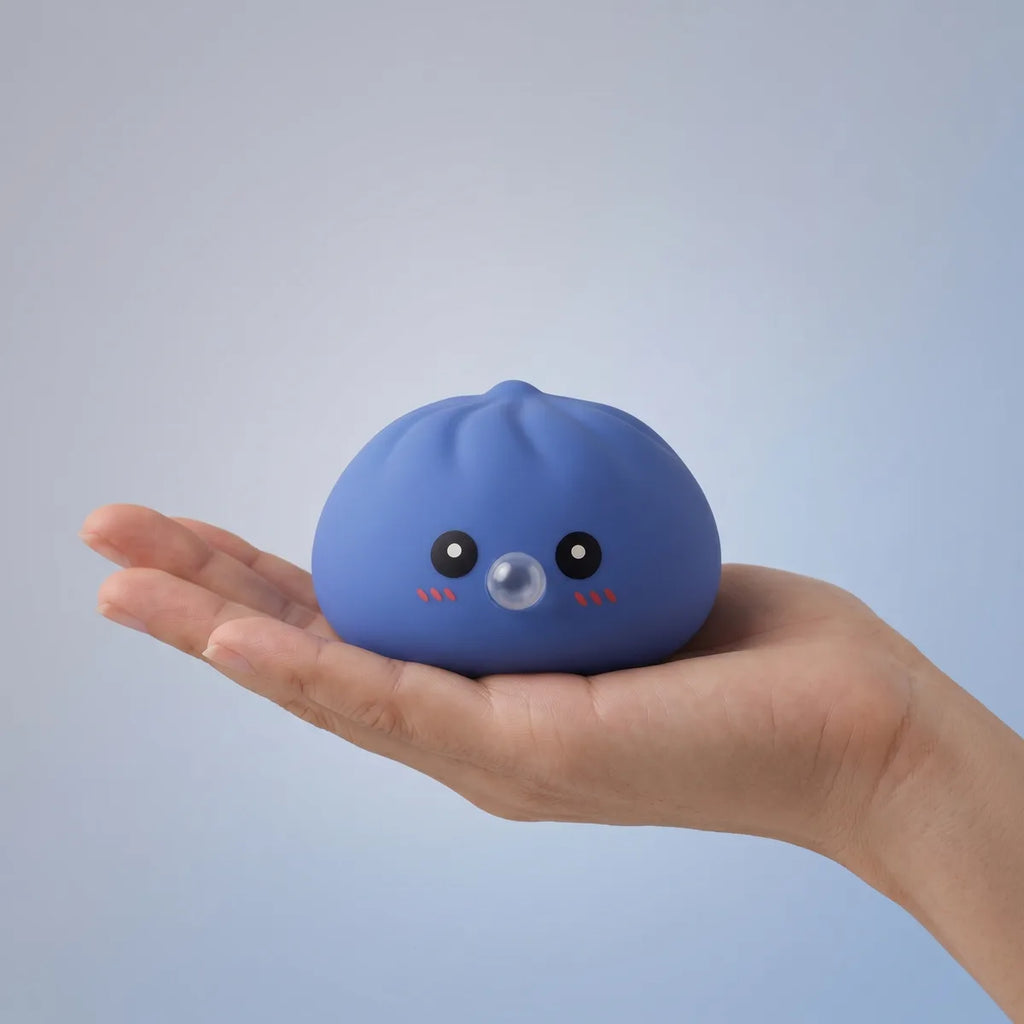 Purple blow dumpling squishy held in hand