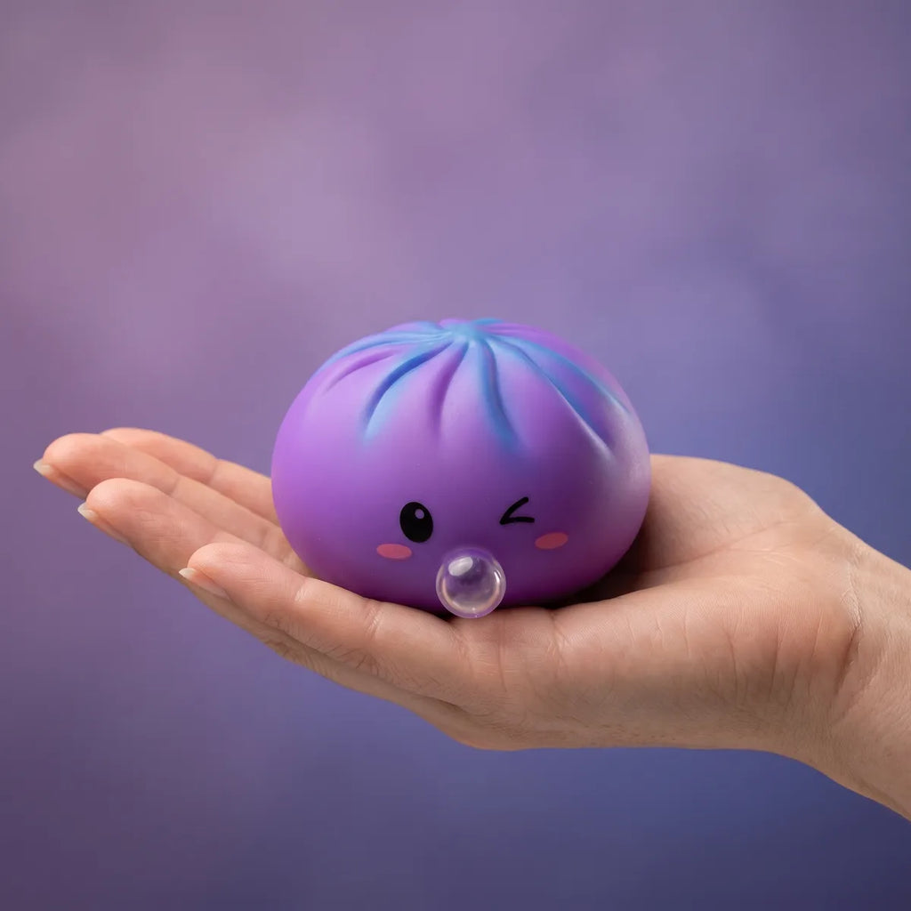 Hand holding a soft purple rare blow dumpling squishy