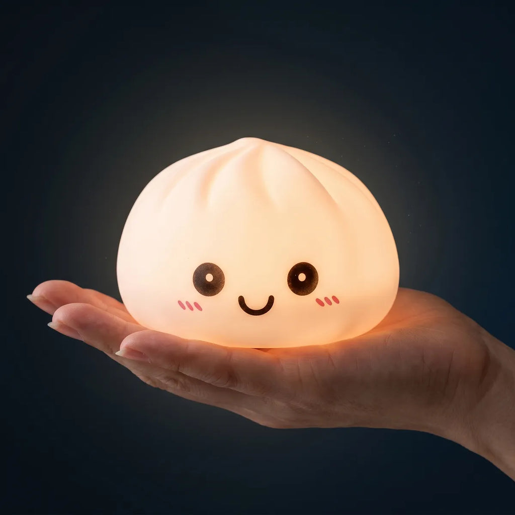 Purple squishy dumpling light held in hand