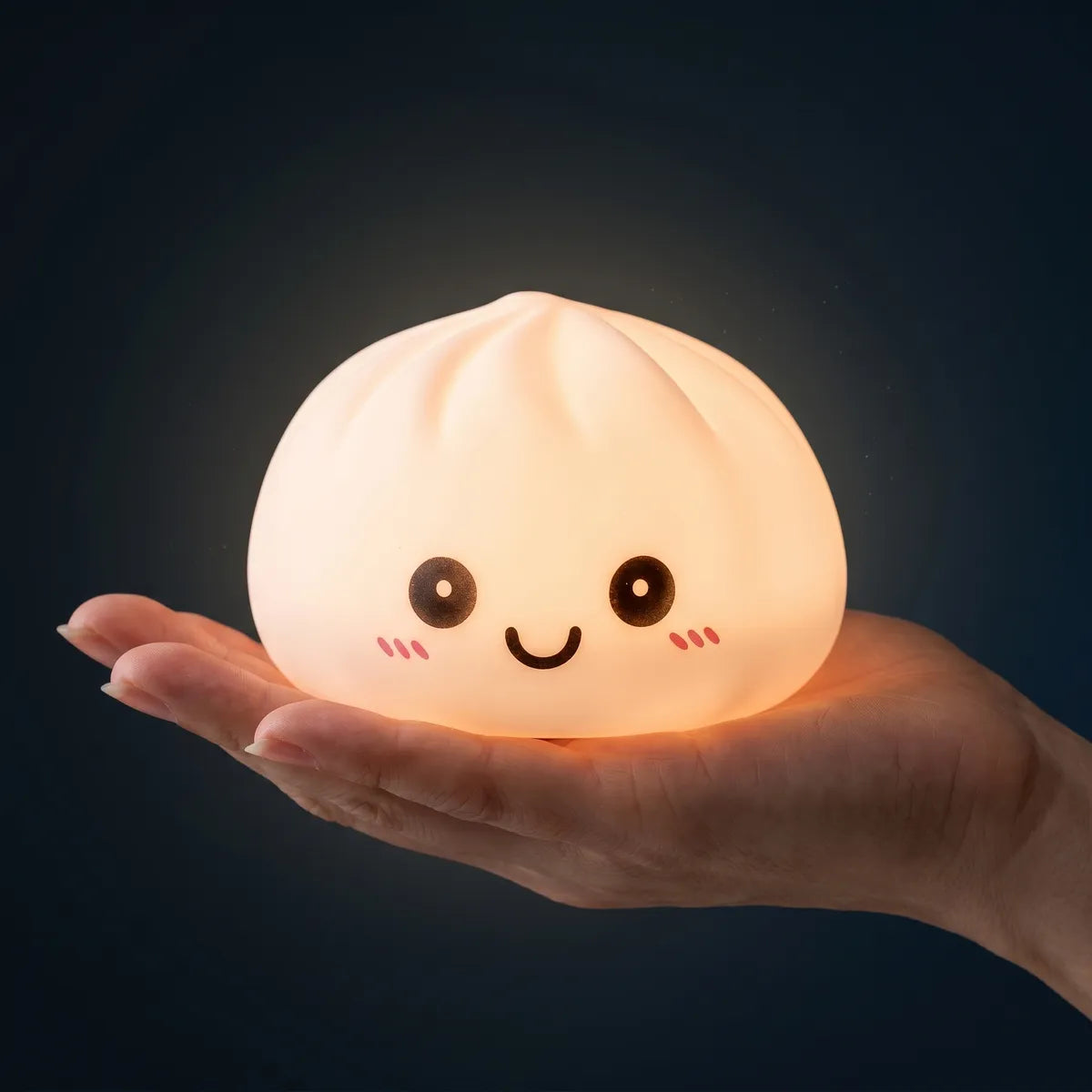 Purple squishy dumpling light held in hand