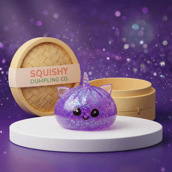 Purple unicorn glitter dumpling squishy with violet glitter and a spiralled horn on a podium