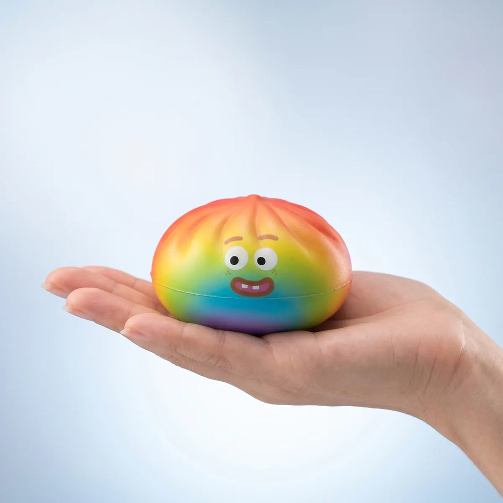 Rainbow mystery squishy dumpling held in hand