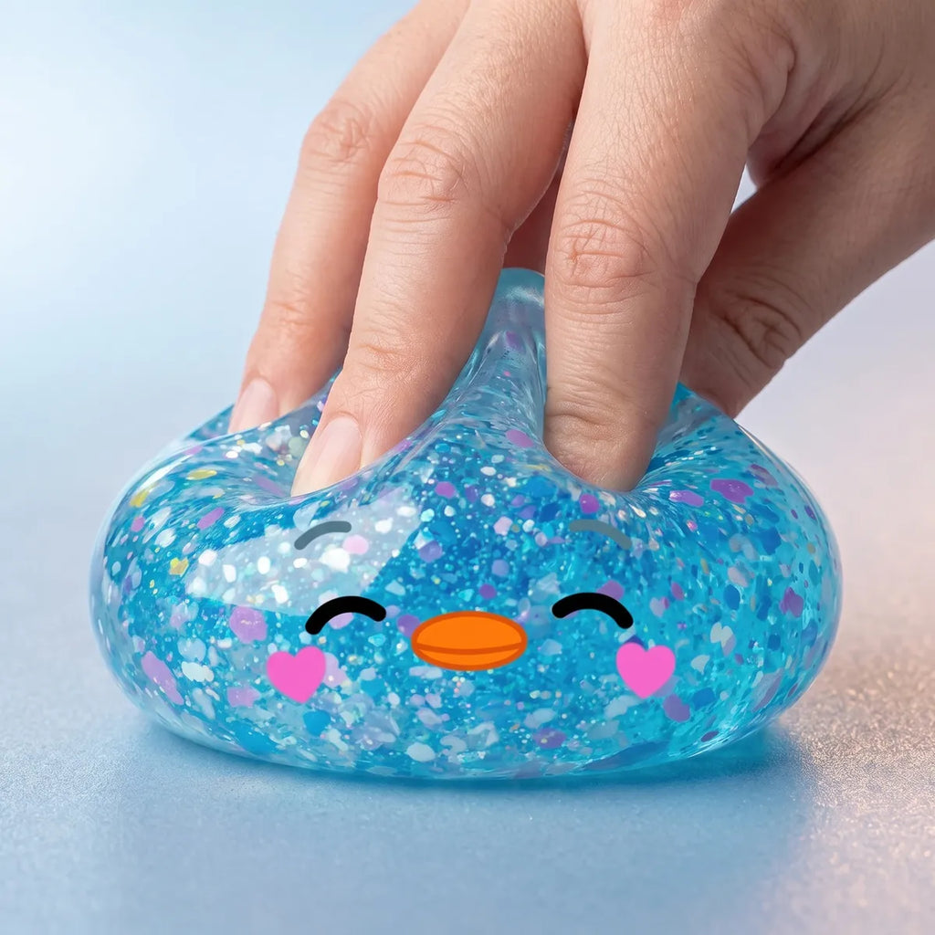 Close up squeeze of the rare blue penguin dumpling squishy showing its heart confetti fill