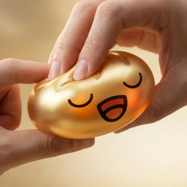 Rare gold dumpling squishy being squeezed showing slow rising foam
