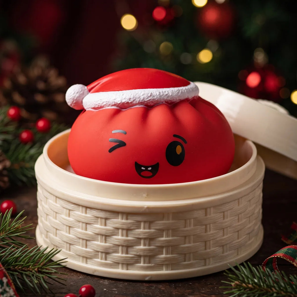 Cheeky Red Christmas Hat Dumpling Squishy sitting inside a round steamer basket