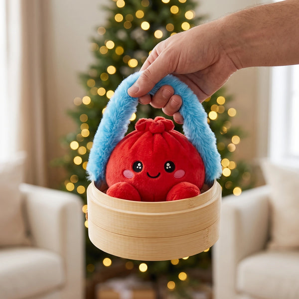 Hand carrying the Ruby Red Dumpling Squishy Plush in its steamer case by the fluffy handle