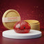 Studio photo of the red glitter dumpling squishy with bamboo steamer