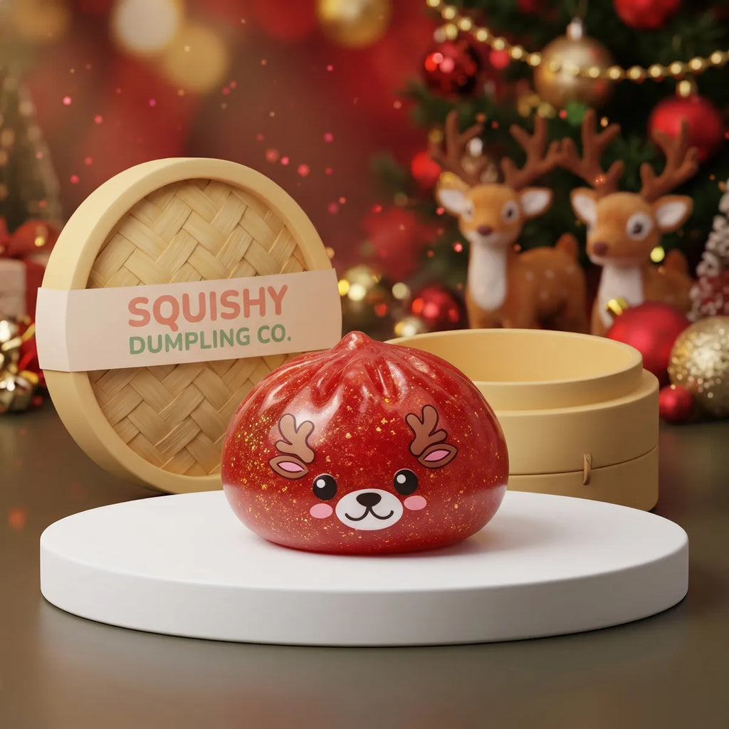 Shimmering Red Reindeer Dumpling Squishy on a white studio podium beside a steamer basket
