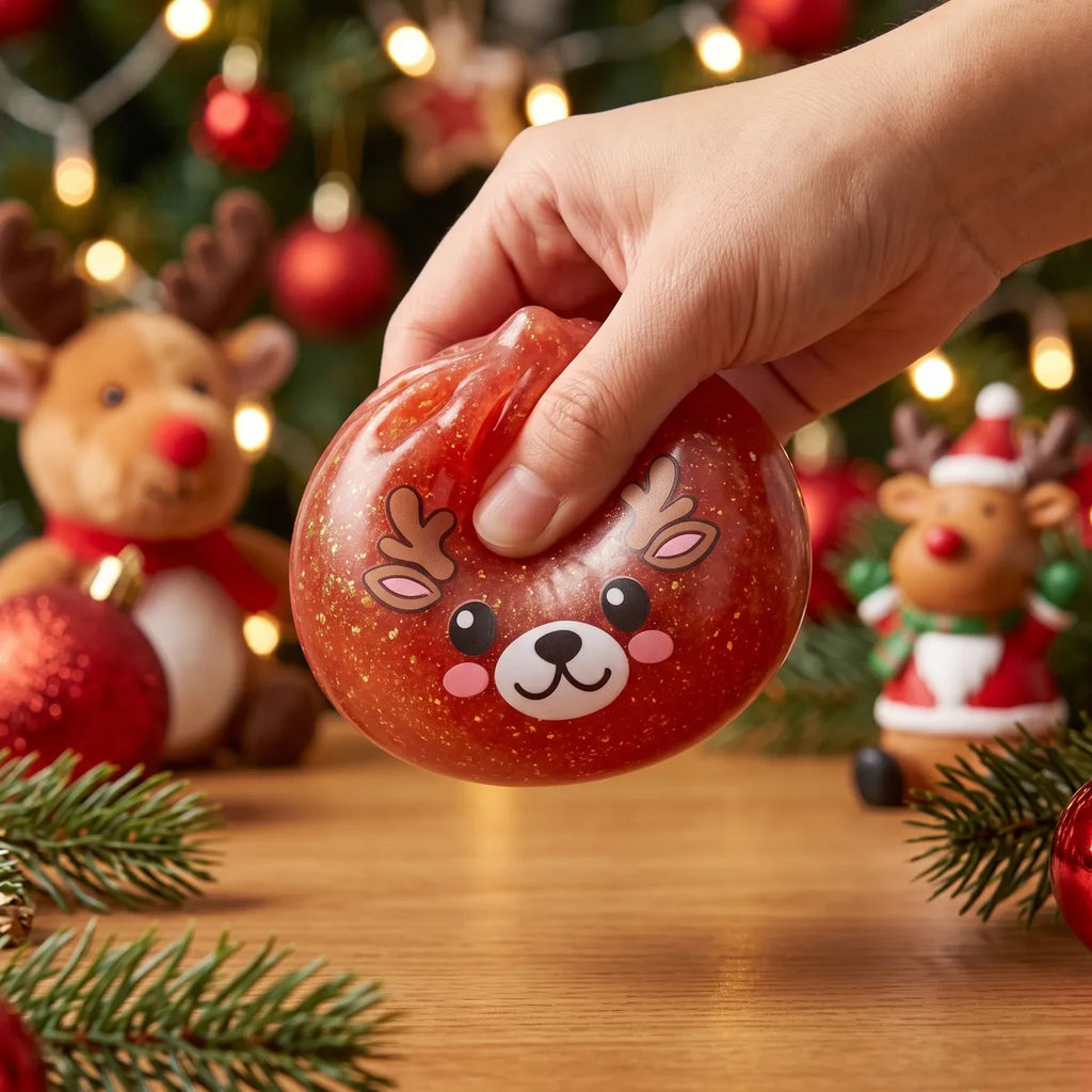 Hand squeezing the Shimmering Red Reindeer Dumpling Squishy so the glitter swirls inside