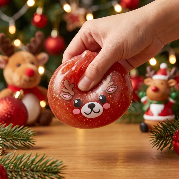 Hand squeezing the Shimmering Red Reindeer Dumpling Squishy so the glitter swirls inside