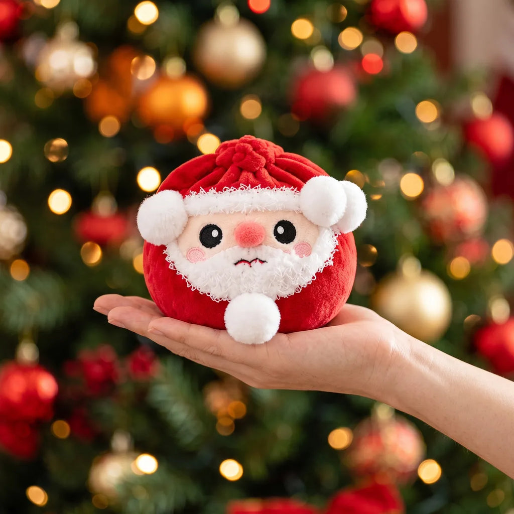 Merry Santa Claus Dumpling Squishy Plush resting on an open palm to show its real size