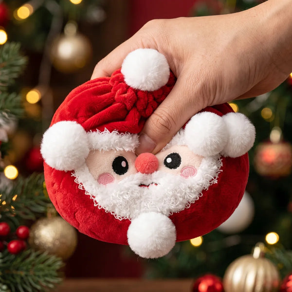 Hand squeezing the Merry Santa Claus Dumpling Squishy Plush