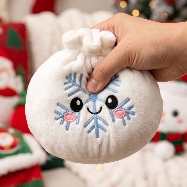 Hand squeezing the Winter Snowflake Dumpling Squishy Plush