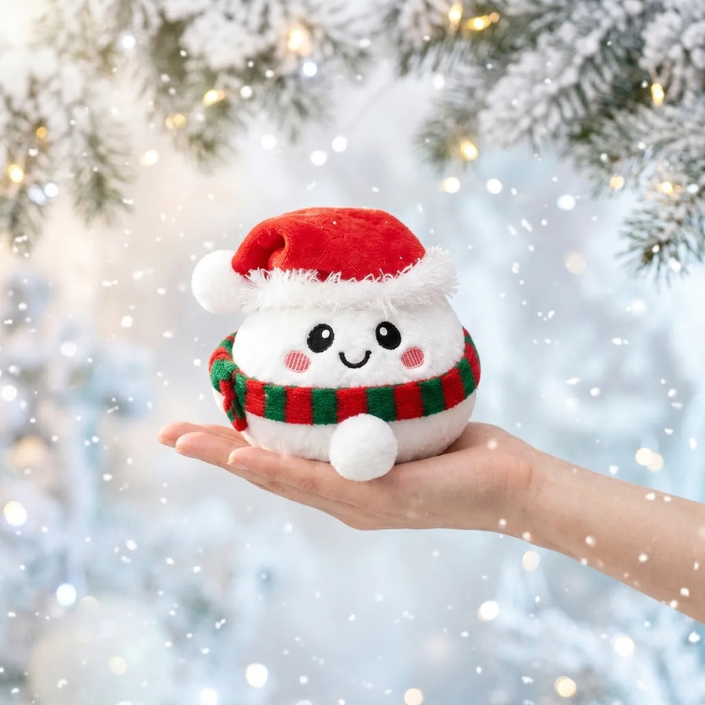 Chilly Snowman Dumpling Squishy Plush resting on an open palm to show its real size