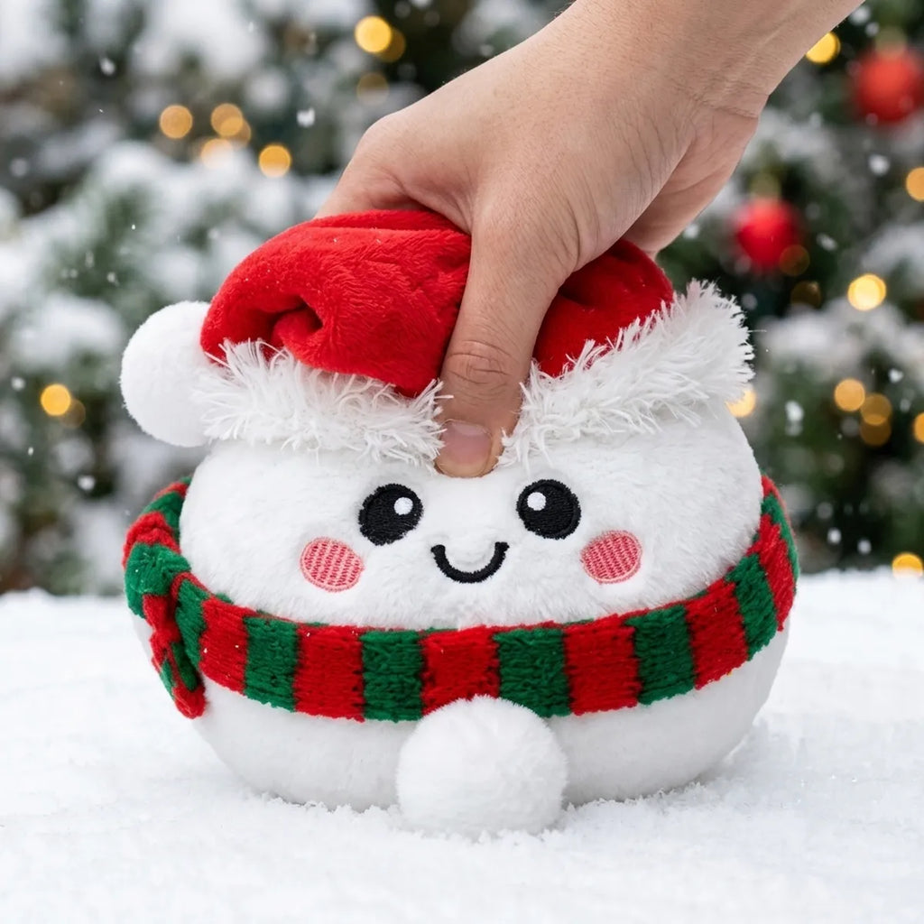 Hand pressing down on the soft Chilly Snowman Dumpling Squishy Plush
