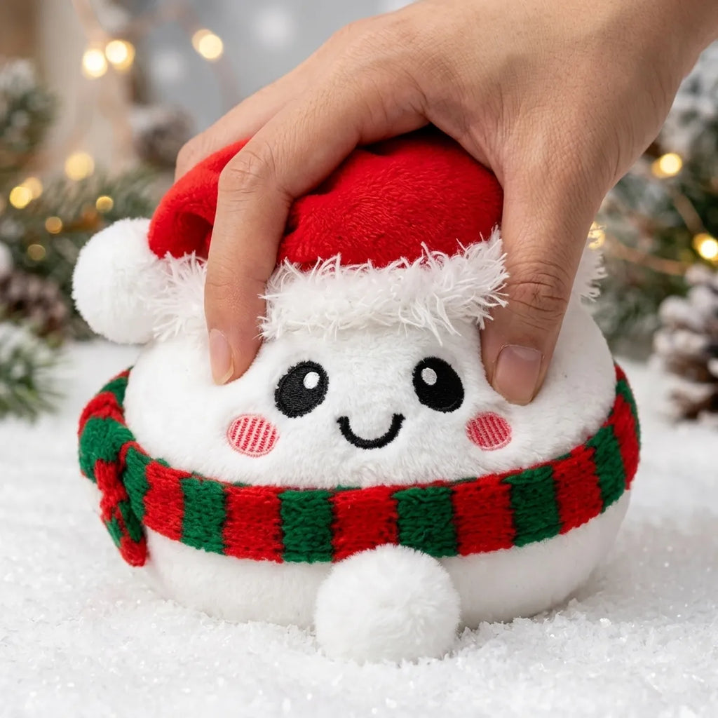 Hand squeezing the Chilly Snowman Dumpling Squishy Plush
