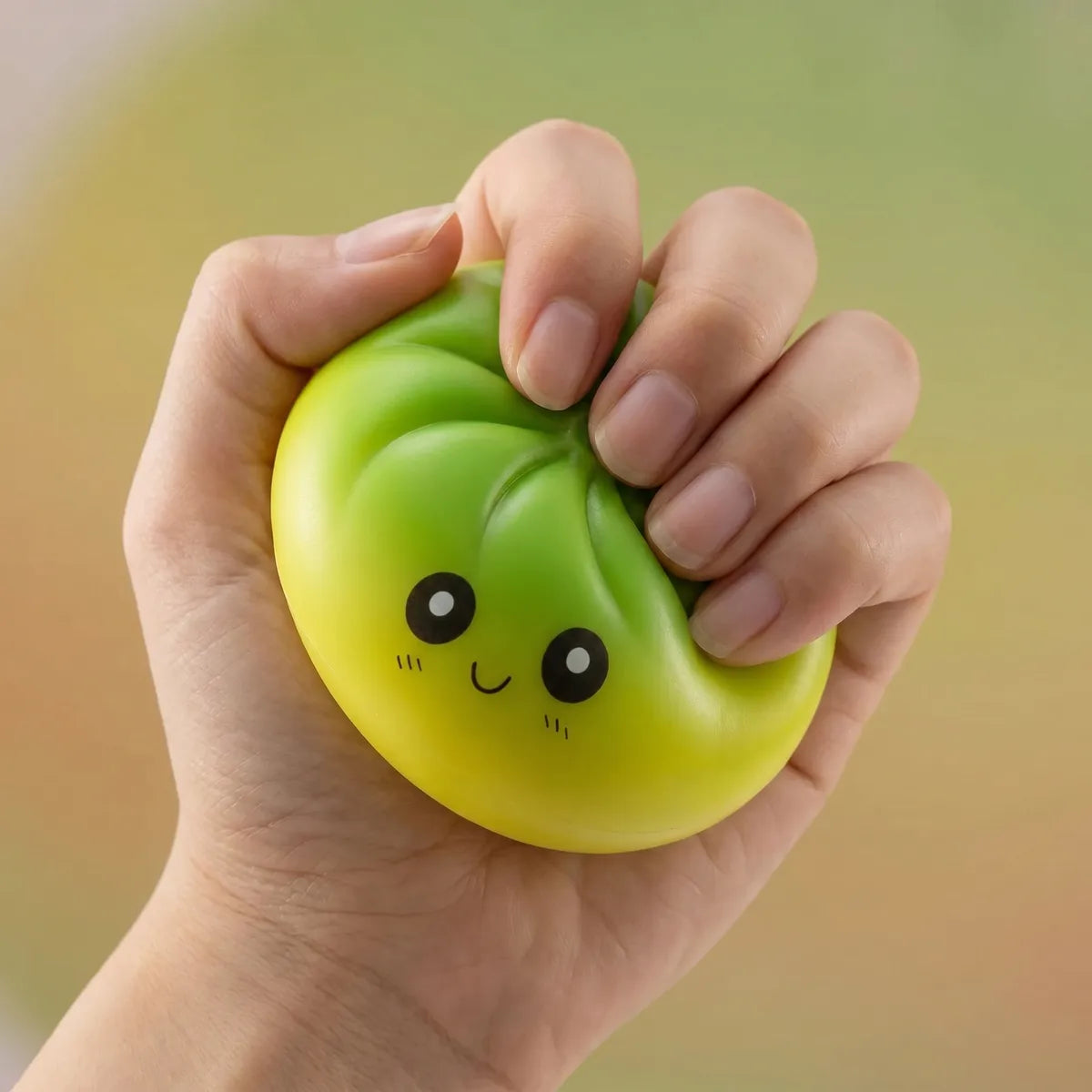 Hands playing with the viral mystery dumpling squishy