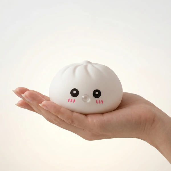 White blow dumpling squishy held in hand