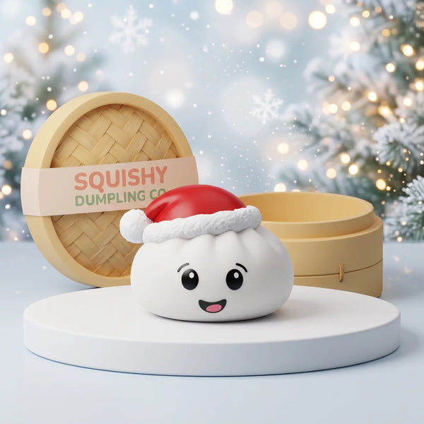 Snowball White Christmas Hat Dumpling Squishy on a white studio podium beside a steamer basket