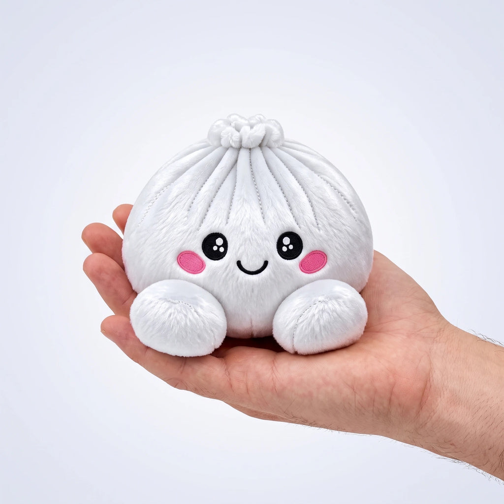 Marshmallow White Dumpling Squishy Plush resting on an open palm to show its real size