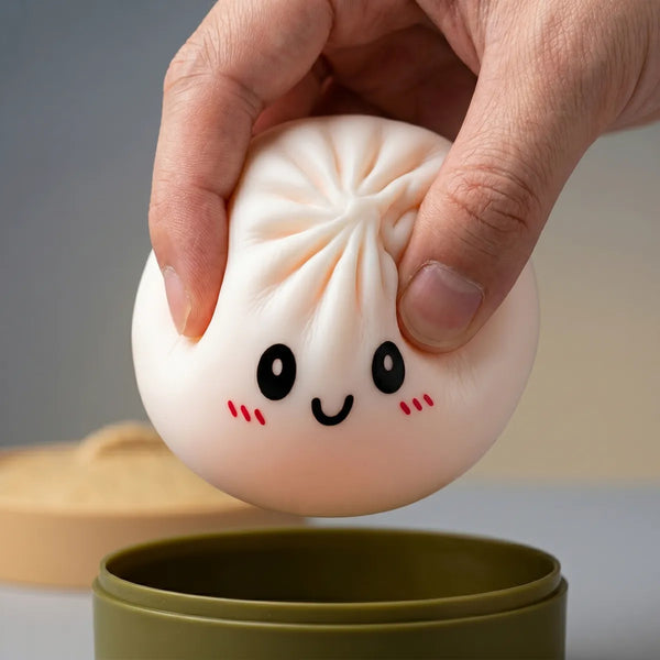 White dumpling squishy being squeezed showing slow rising foam