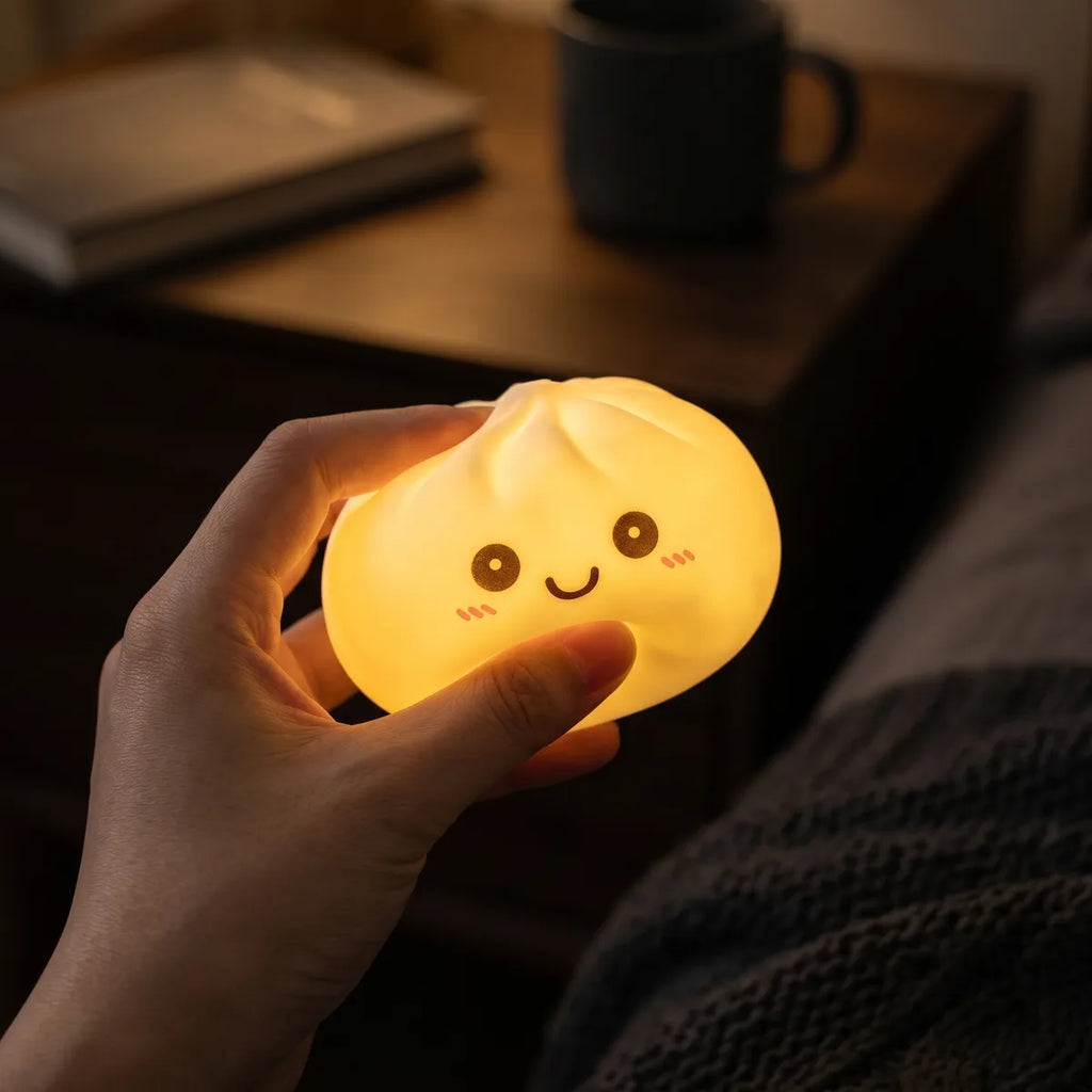 White squishy dumpling light glowing softly in a dark room