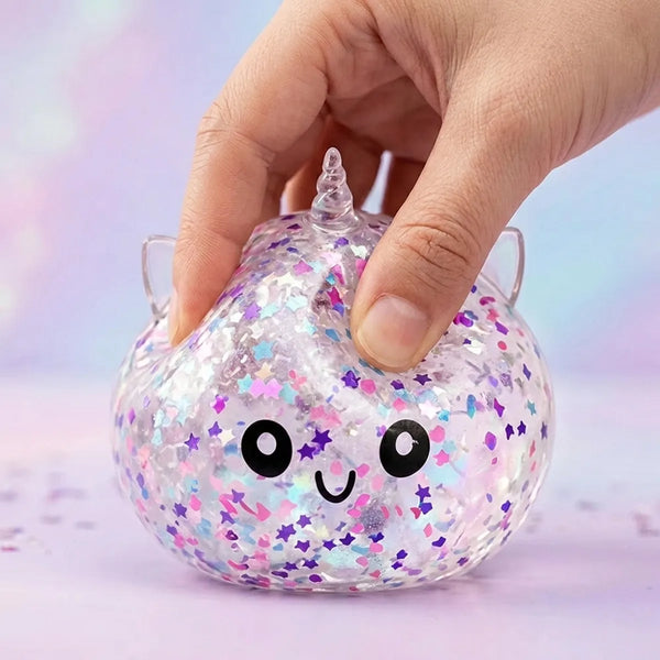 Close up squeeze of the white unicorn sparkle dumpling squishy showing the floating star confetti