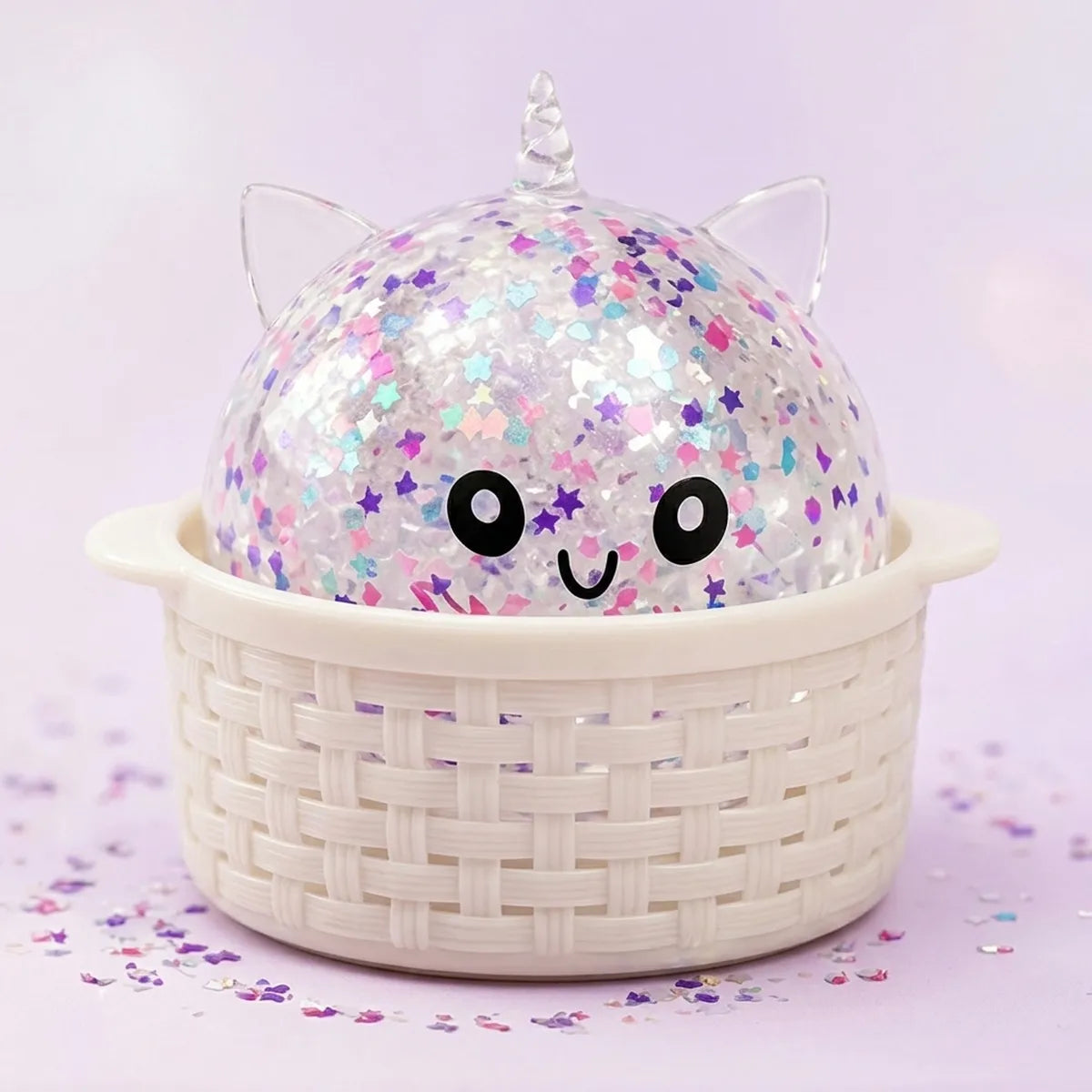 White unicorn sparkle dumpling squishy resting in its bamboo steamer box