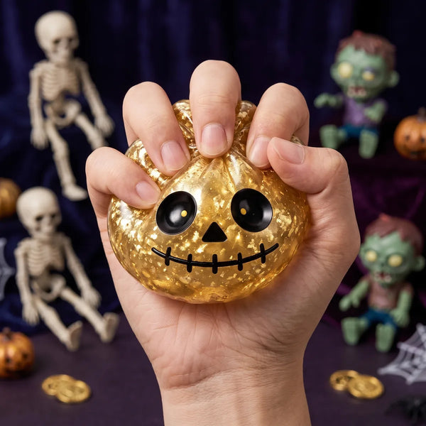 Zombie Halloween dumpling squishy squeezed flat to show its slow rising gold glitter gel